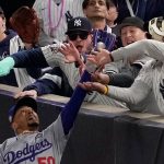 Baseball fans banned after grappling with player during World Series