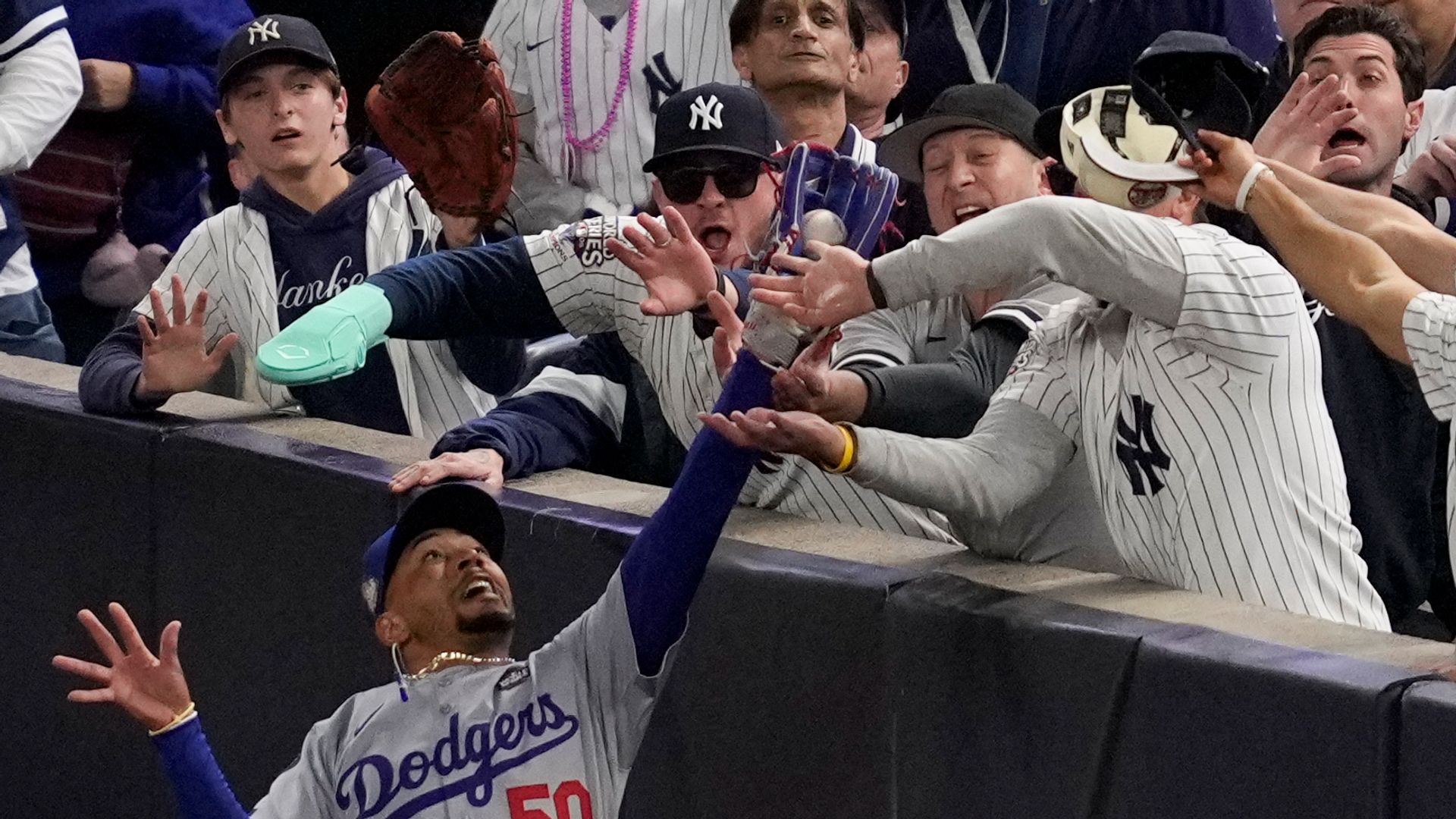 Baseball fans banned after grappling with player during World Series