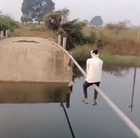 Video: Man Uses Pipe To Cross Collapsed Bridge In Telangana