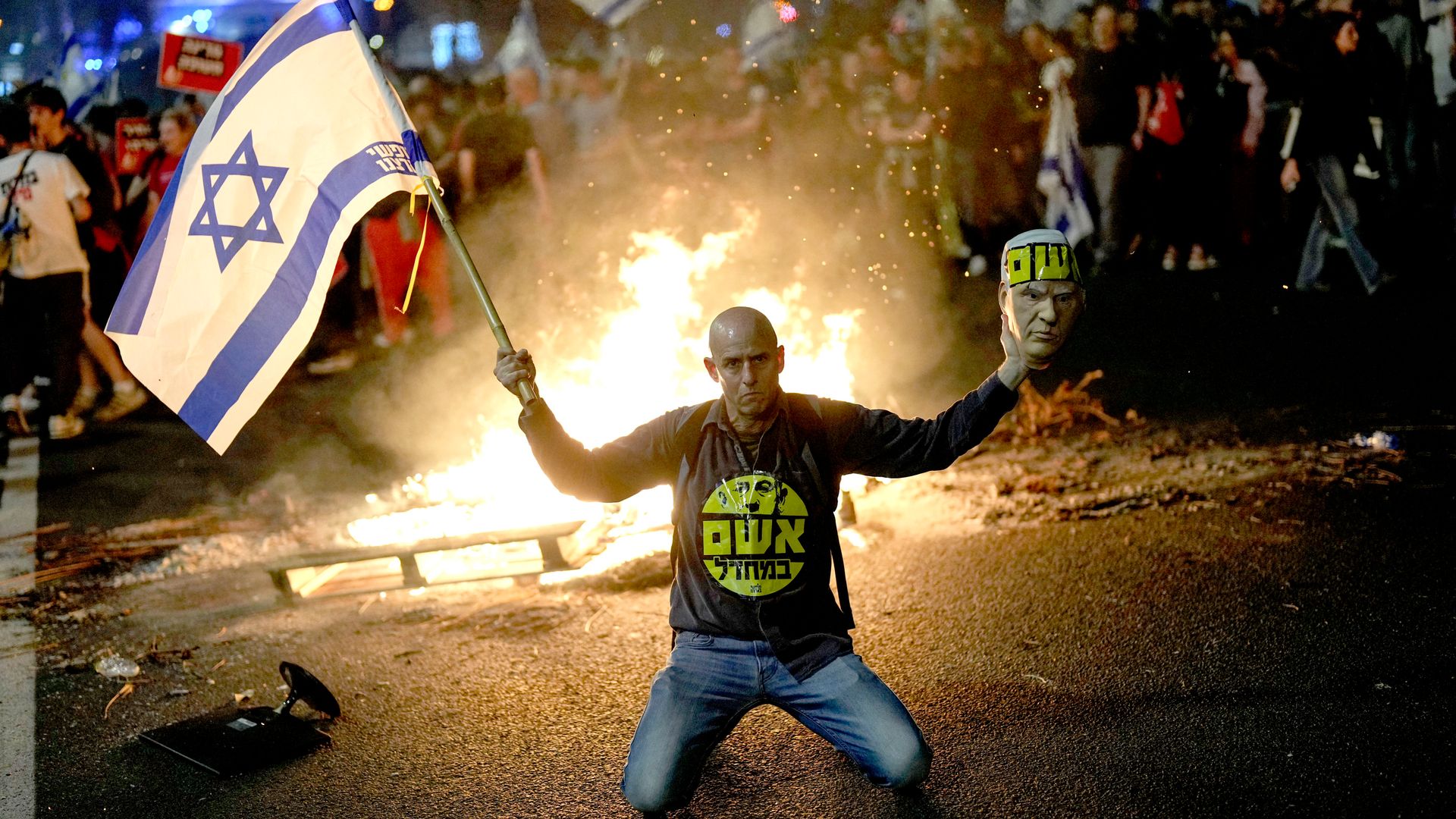 Thousands join street protests after Israeli defence minister sacked by Netanyahu