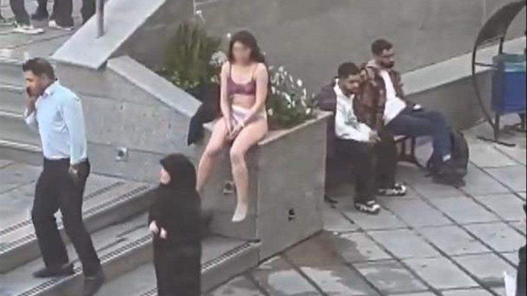 Woman ‘violently arrested’ after stripping to protest strict Islamic dress code – reports