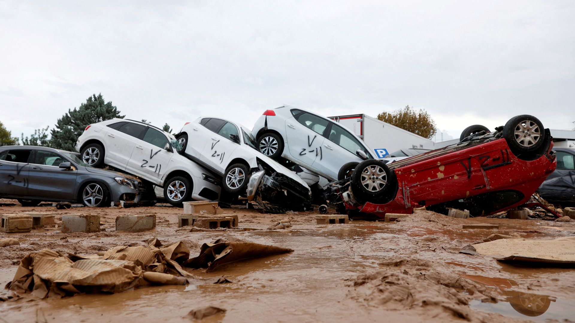 Angry crowds hurl mud and insults at King of Spain as he visits town devastated by floods